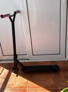 Trek - trotinet za trikove Glober