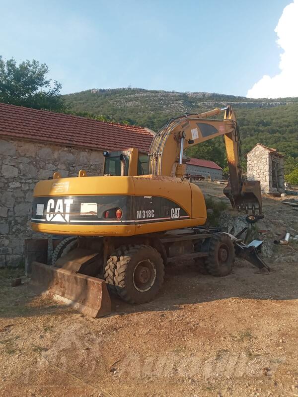 CAT - m318c